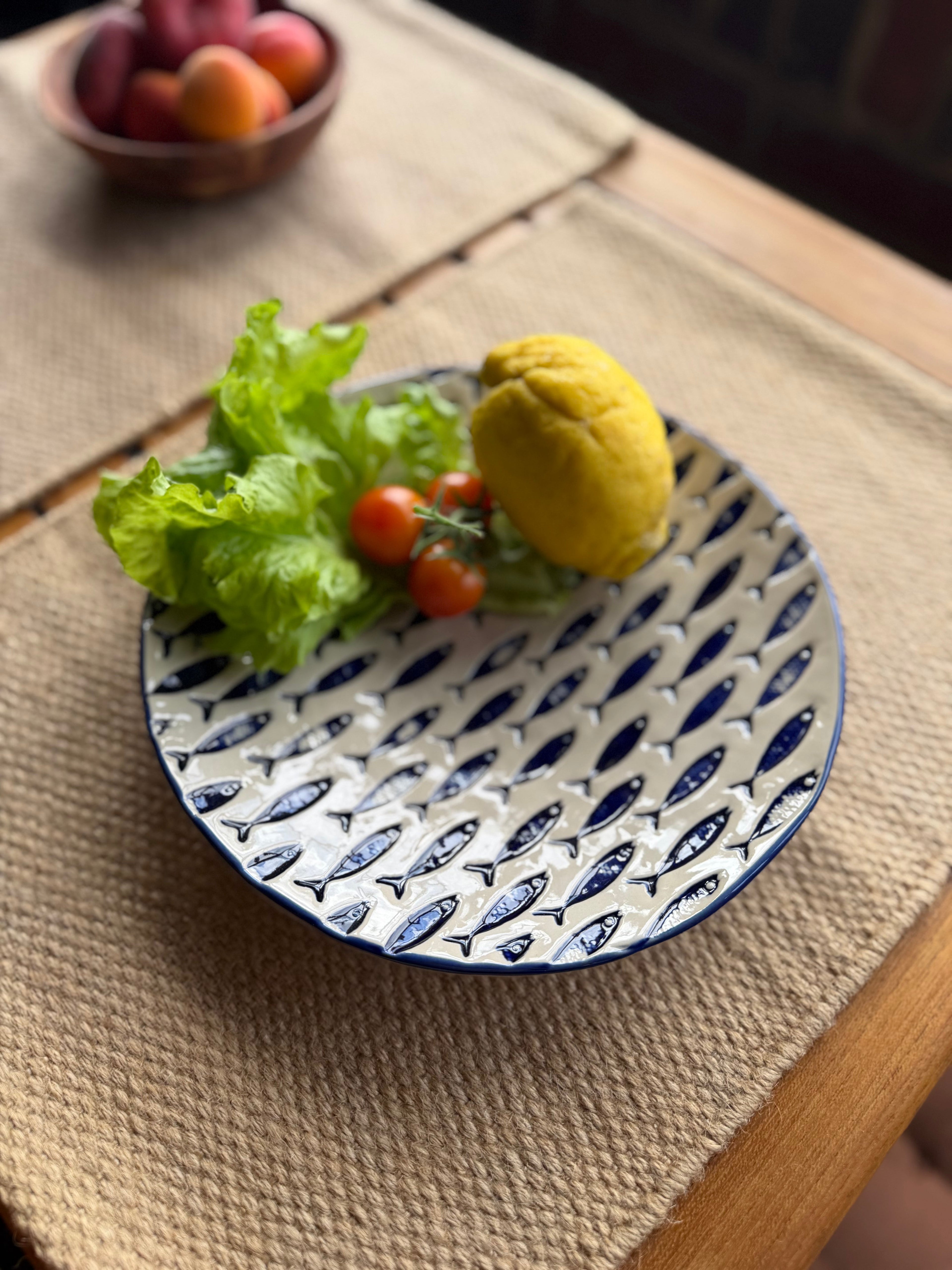 Stentøjstallerkner med fiskemotiver